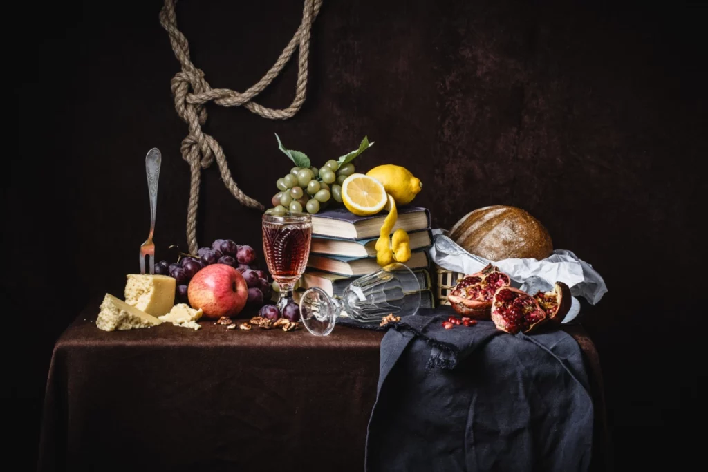 ToF Behang schilderij stilleven in Hollandse stijl met fruit, kaas en boeken